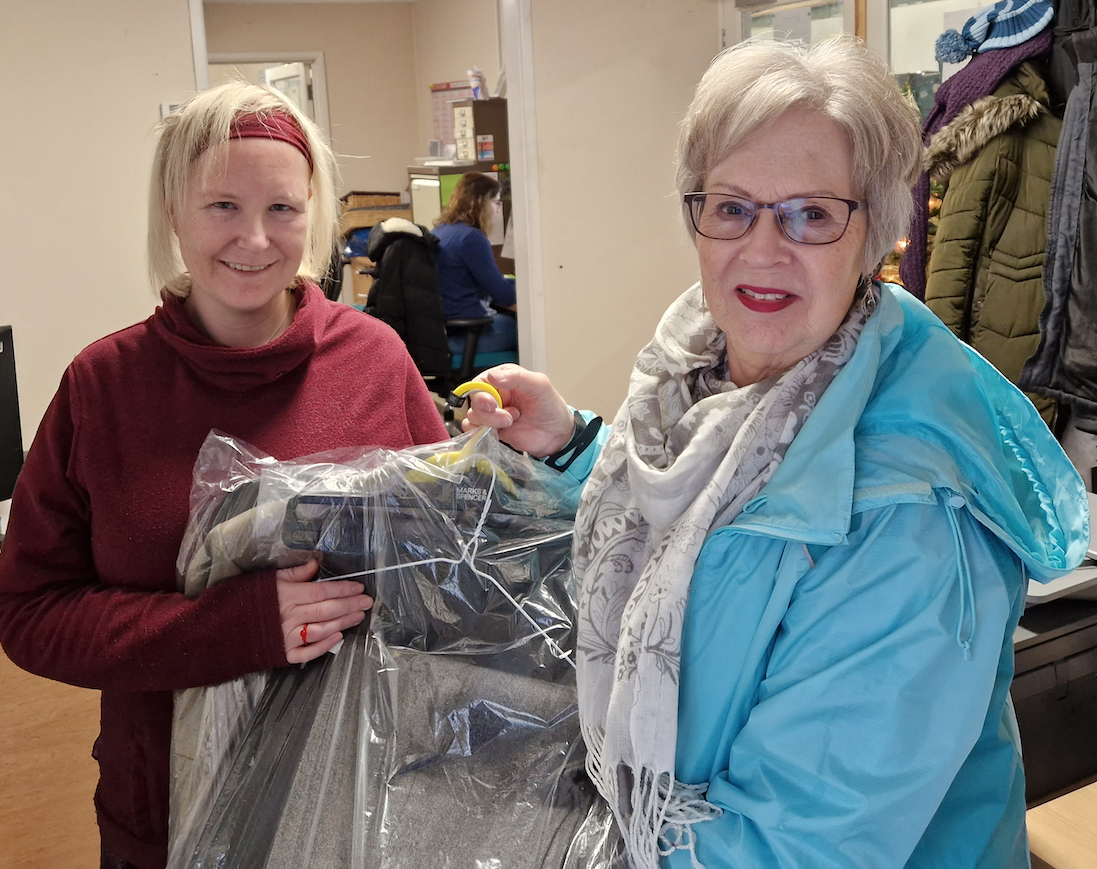 Janet delivering clothes to the clothes bank