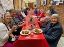 these ladies being served with their Christmas lunch, it looks good!